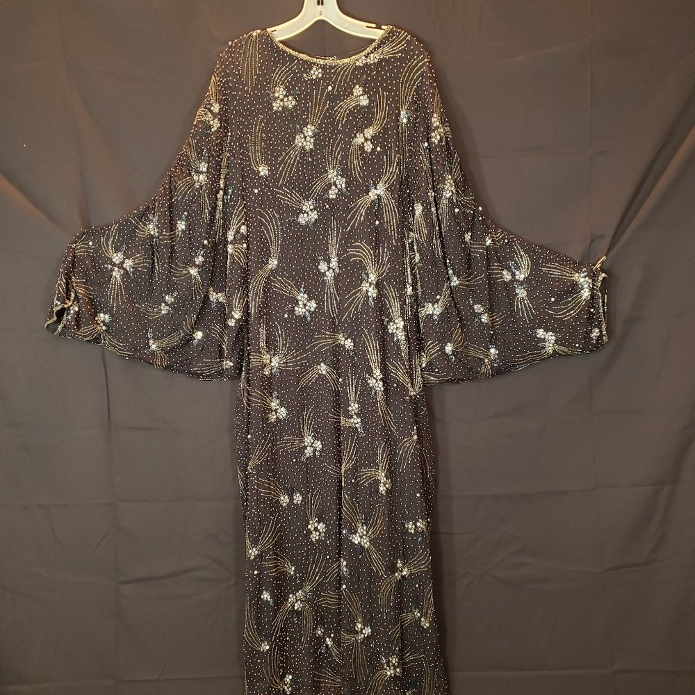 Long sleeved formal full length black beaded gown with sequins